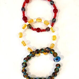 Lot of 3 bracelets approx 7" stretch chord yellow red blue Discount Shipping!!